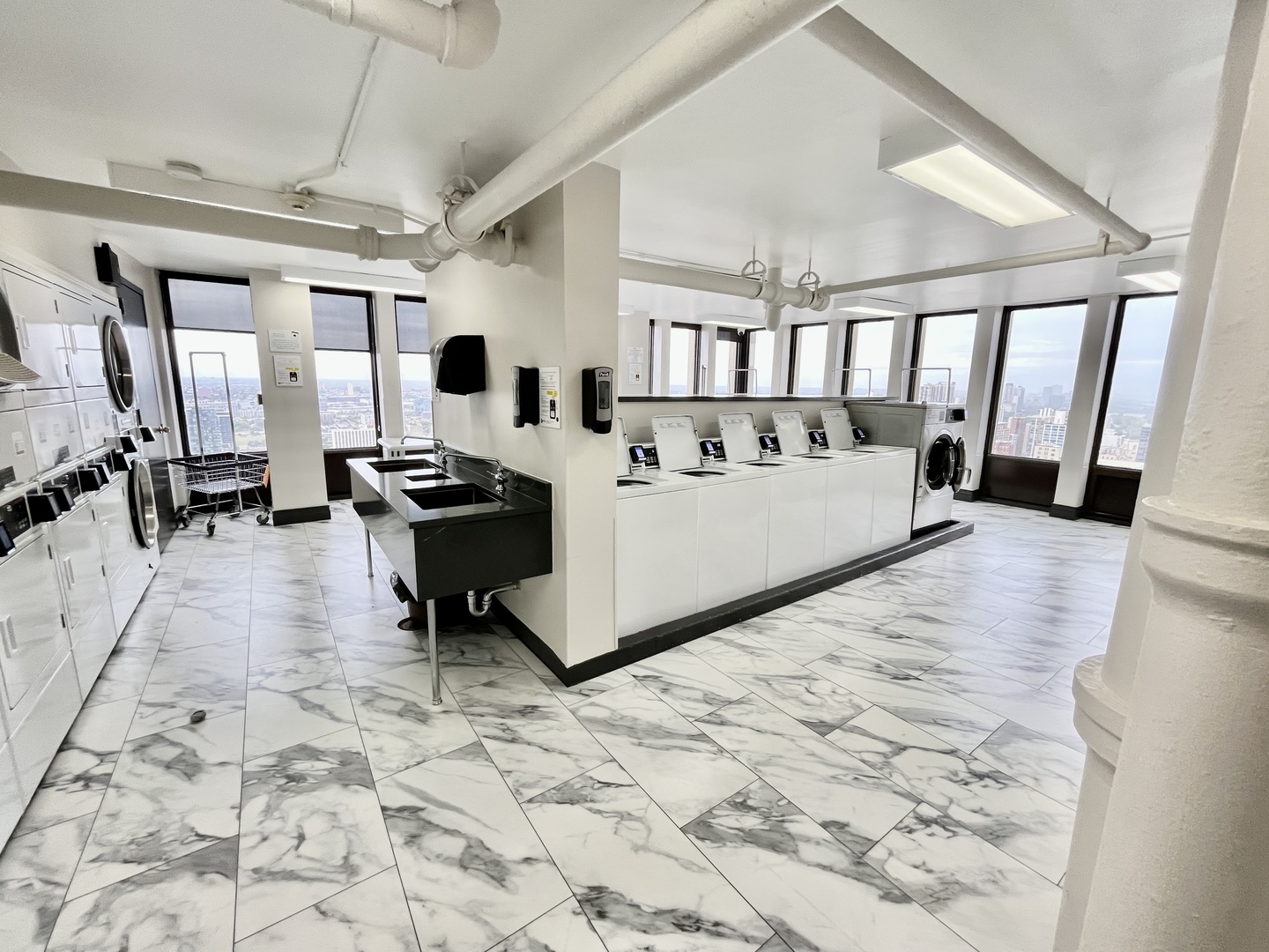 100 East Walton Place, Unit 14A Chicago, IL 60611 - Photo 18 of 19 a living room with a couch and a table