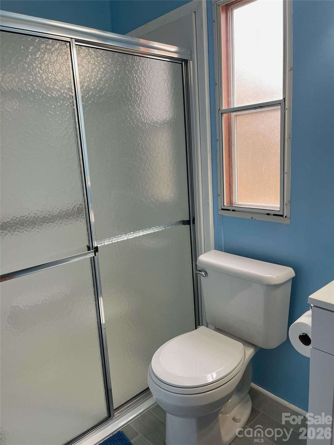 205 Star Road York, SC 29745 - Photo 11 of 15 a white toilet sitting next to a shower