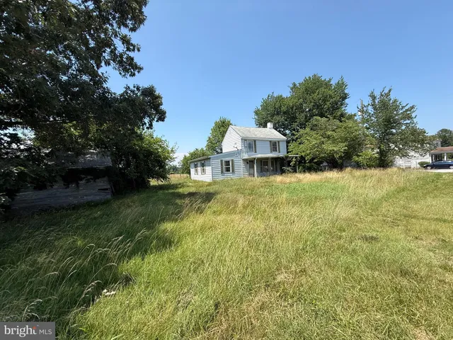 a view of a house with a big yard