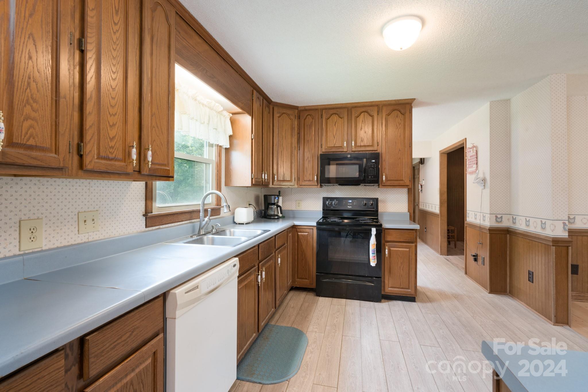4120 Bookout Road Rock Hill, SC 29730 - Photo 19 of 47 a kitchen with stainless steel appliances granite countertop a stove a sink dishwasher a refrigerator and a microwave oven