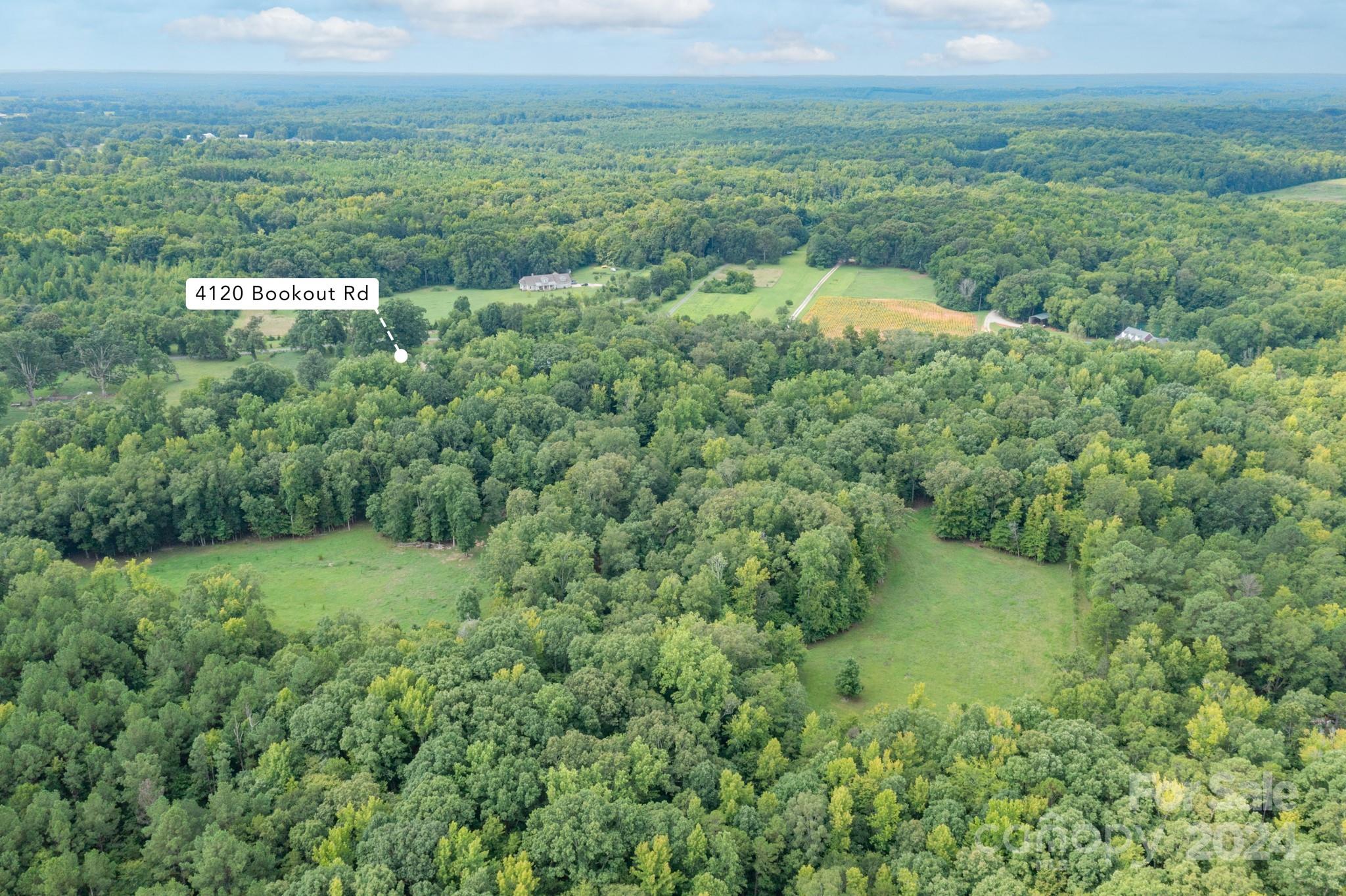 4120 Bookout Road Rock Hill, SC 29730 - Photo 2 of 47 a view of a field of grass and trees