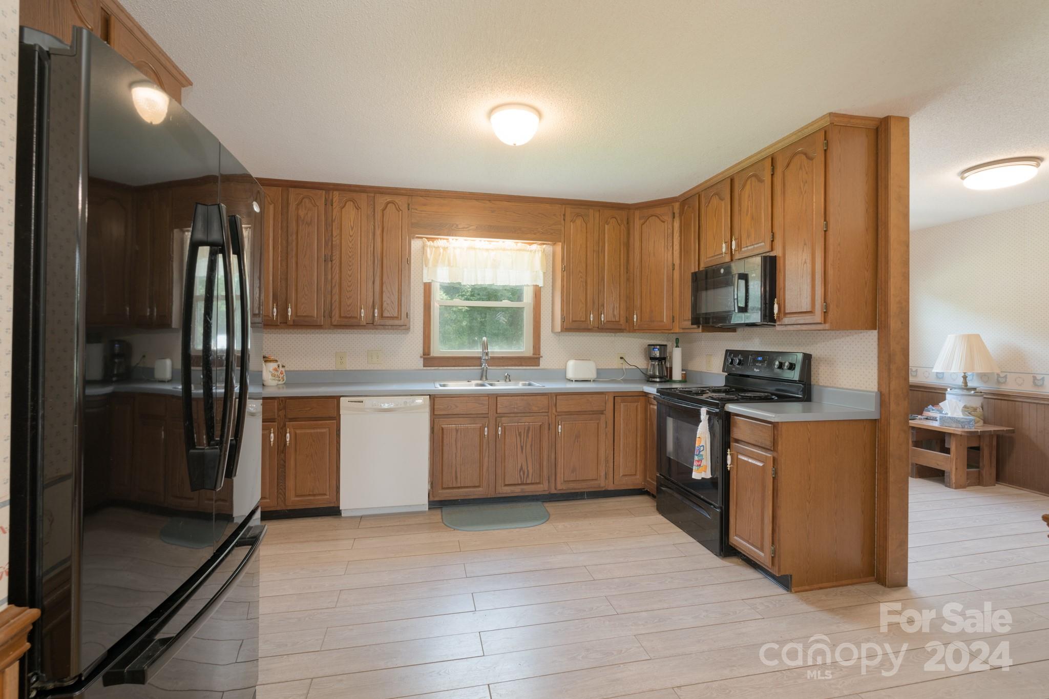 4120 Bookout Road Rock Hill, SC 29730 - Photo 22 of 47 a kitchen with stainless steel appliances a refrigerator sink and microwave