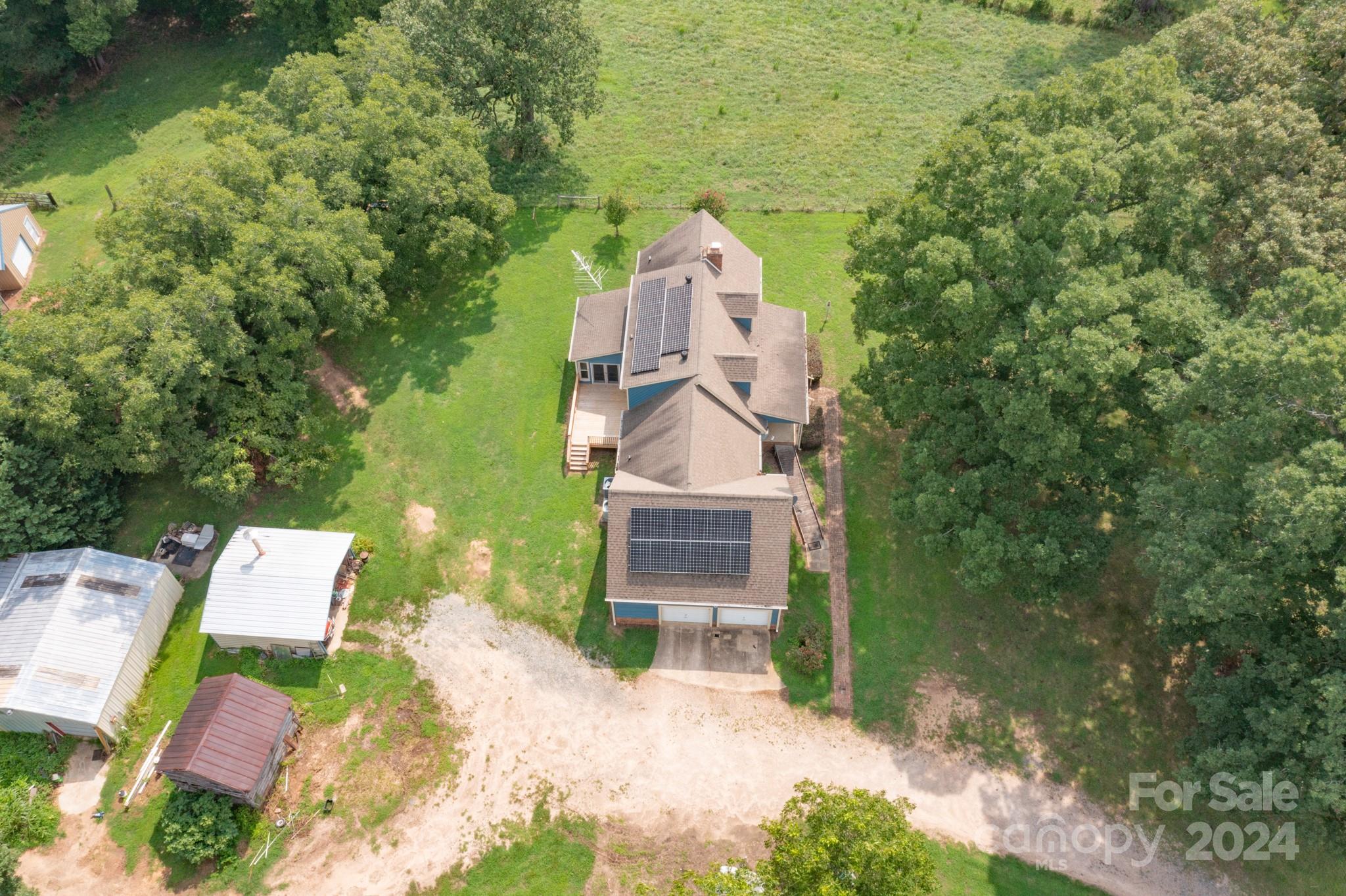 4120 Bookout Road Rock Hill, SC 29730 - Photo 37 of 47 an aerial view of a house with a yard and large tree