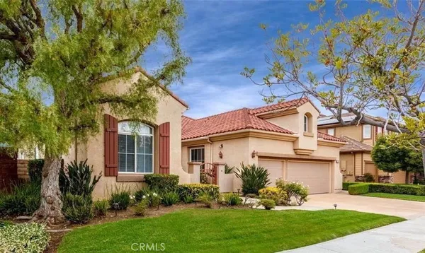 front view of a house with a garden