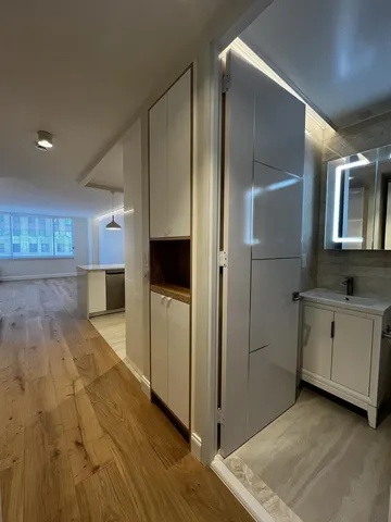 a view of a kitchen from the hallway