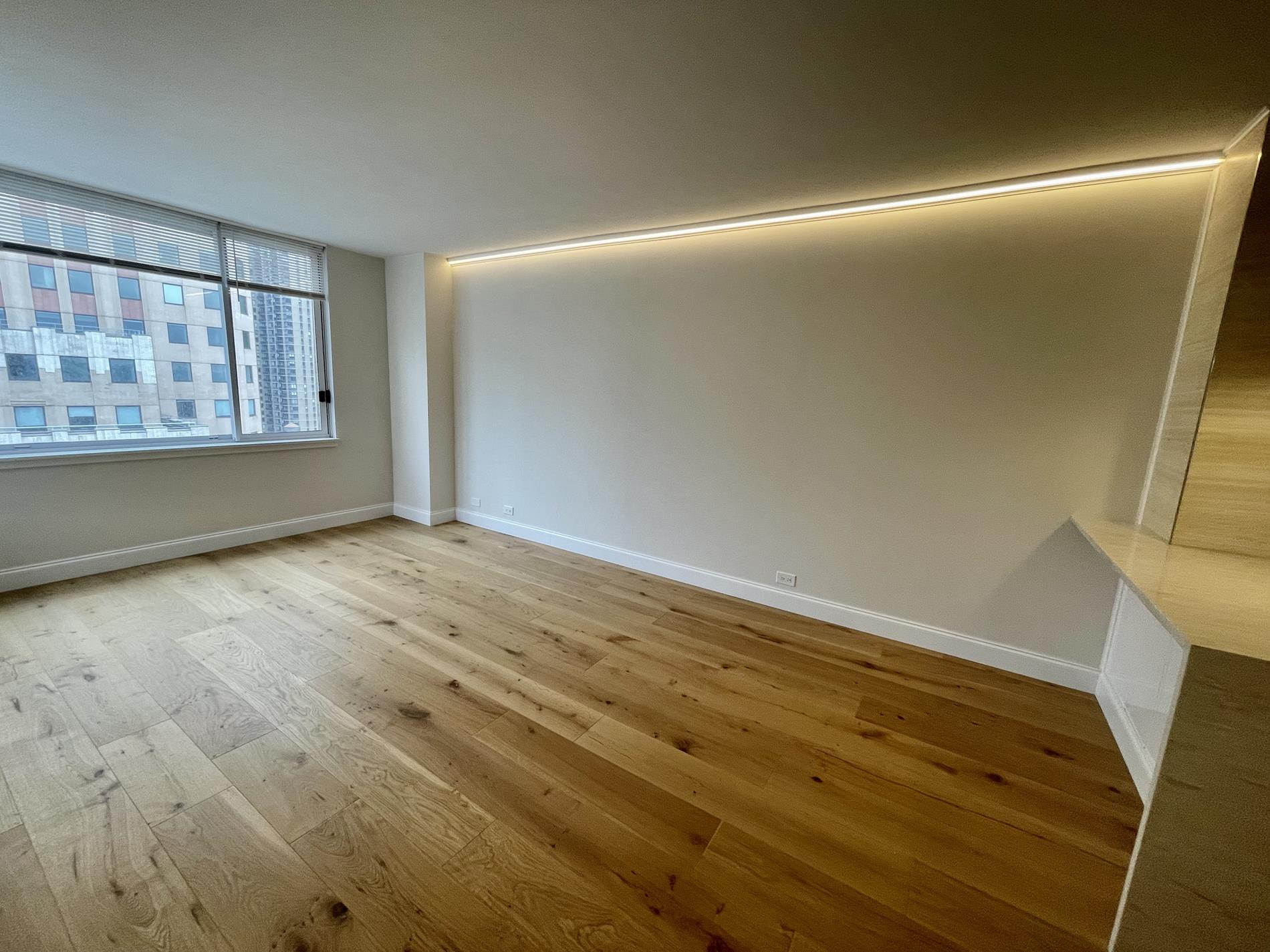 Undisclosed Address Manhattan, NY 10019 - Photo 2 of 13 wooden floor in an empty room with a window