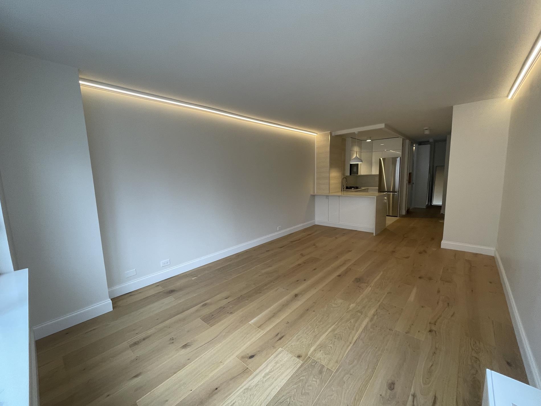 Undisclosed Address Manhattan, NY 10019 - Photo 6 of 13 a view of empty room with wooden floor