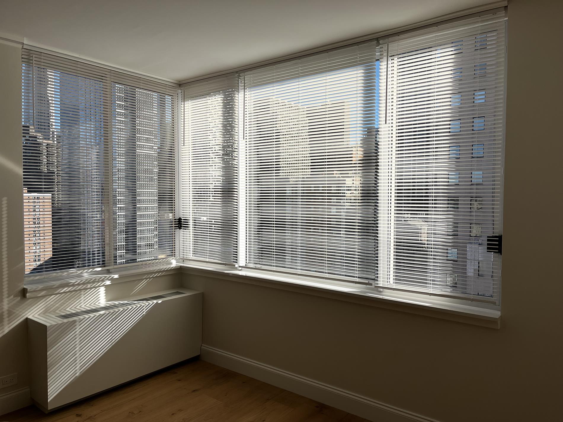 Undisclosed Address Manhattan, NY 10019 - Photo 7 of 13 a view of an empty room with a window