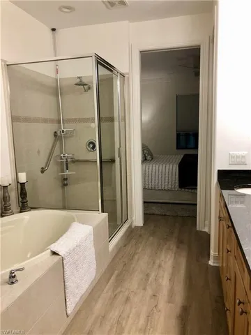 a bathroom with a tub and a sink