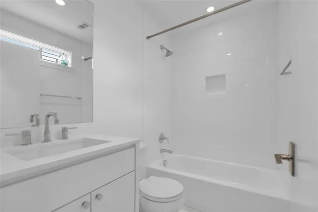 a bathroom with a sink a toilet and a bathtub