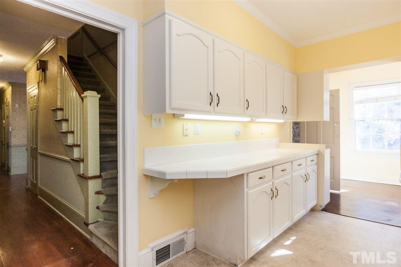 1707 Jarvis Street Raleigh, NC 27608 - Photo 13 of 25 a bathroom with a tub sink and mirror