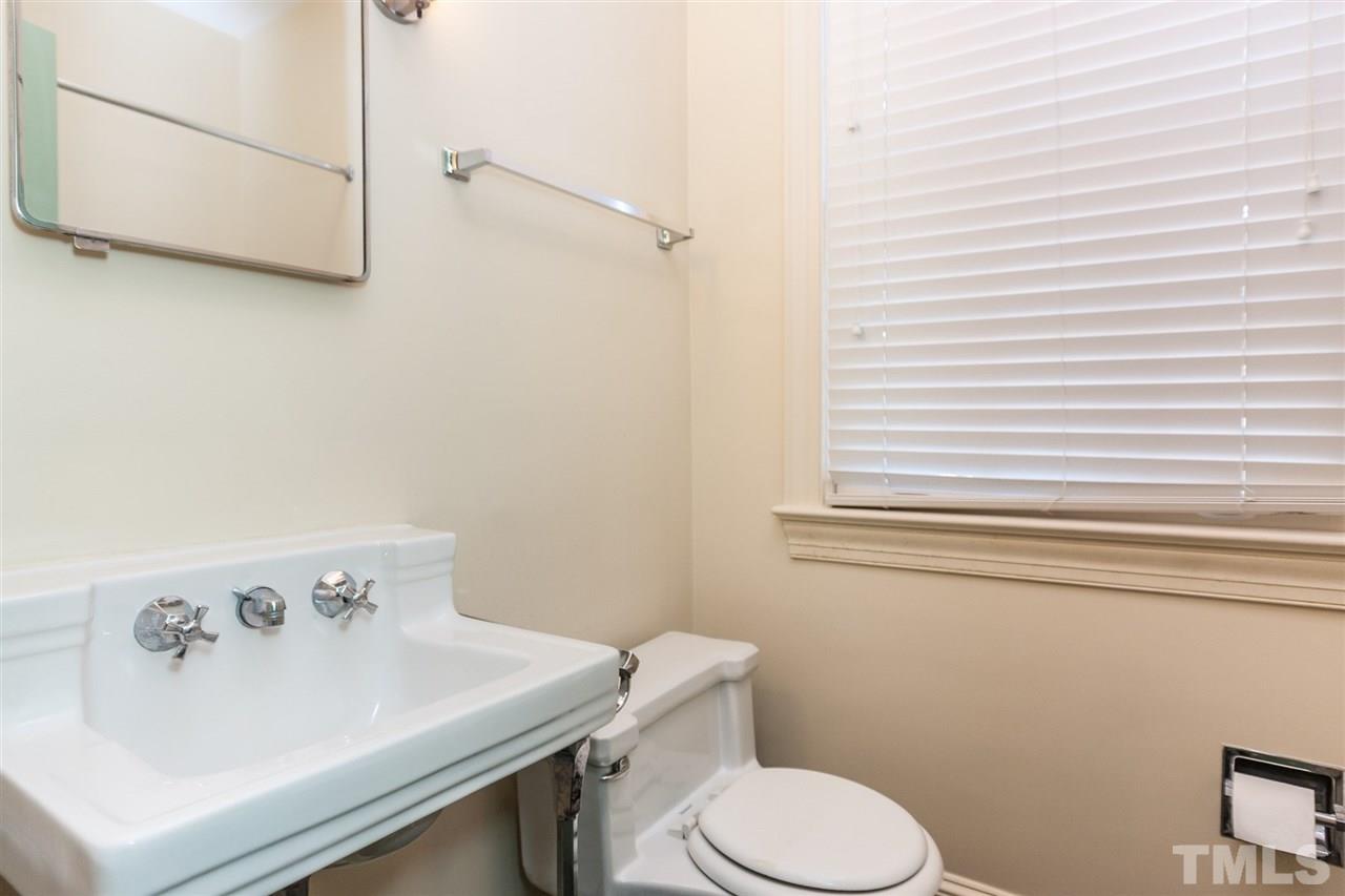 1707 Jarvis Street Raleigh, NC 27608 - Photo 16 of 25 a bathroom with a sink and a toilet