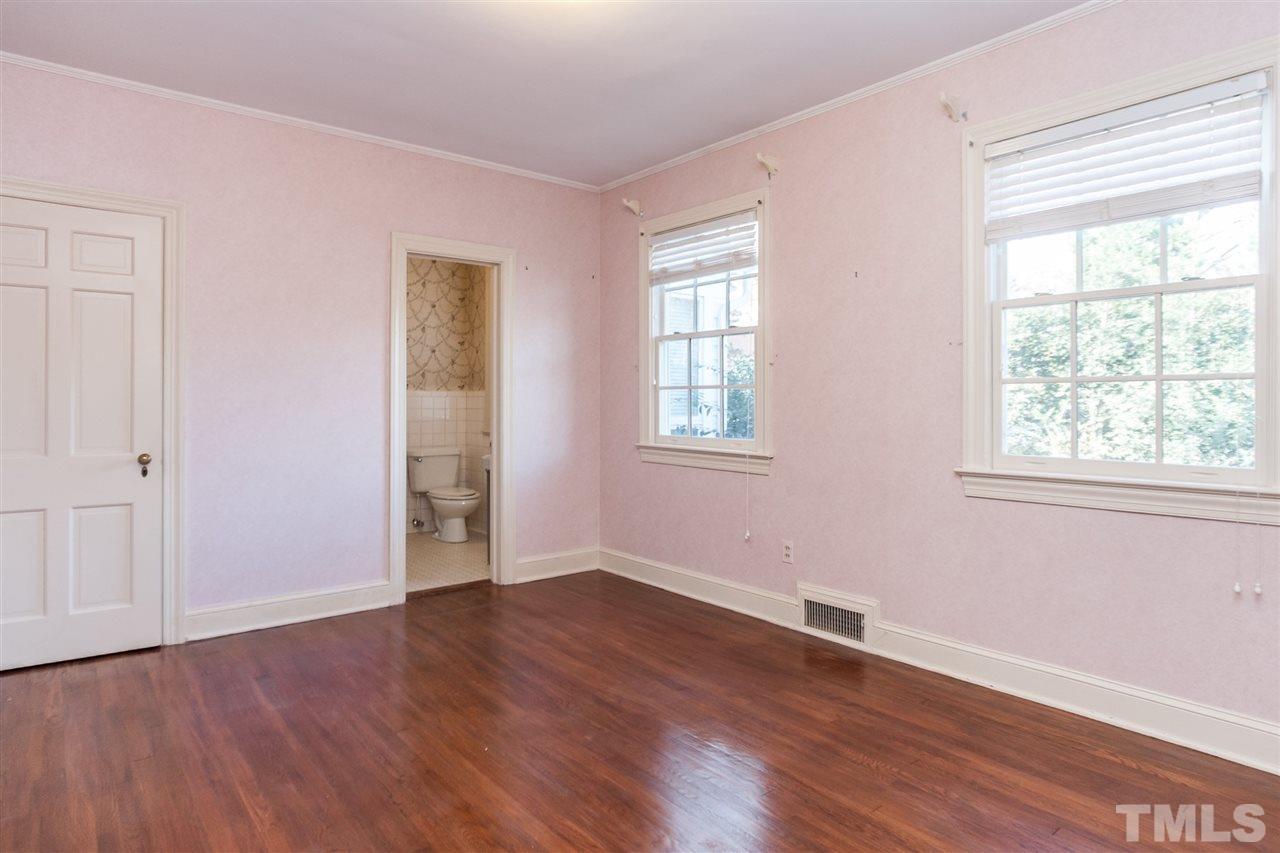 1707 Jarvis Street Raleigh, NC 27608 - Photo 19 of 25 an empty room with wooden floor and windows