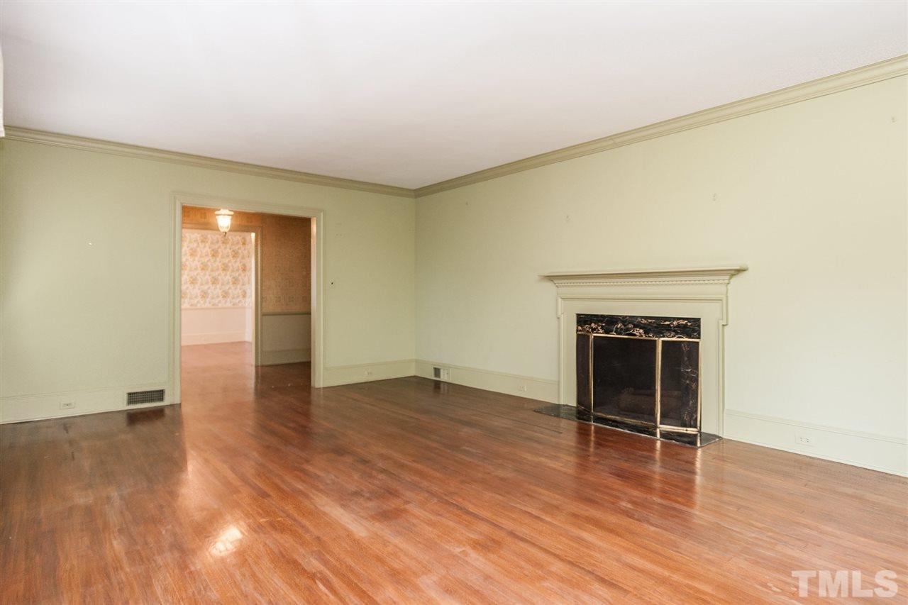 1707 Jarvis Street Raleigh, NC 27608 - Photo 7 of 25 an empty room with wooden floor and windows