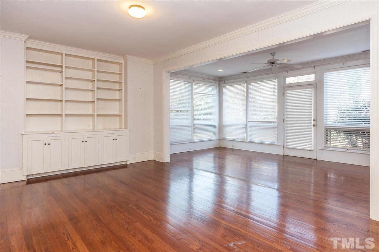 1707 Jarvis Street Raleigh, NC 27608 - Photo 8 of 25 wooden floor in an empty room with a window