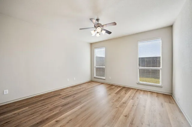 a view of an empty room and wooden floor