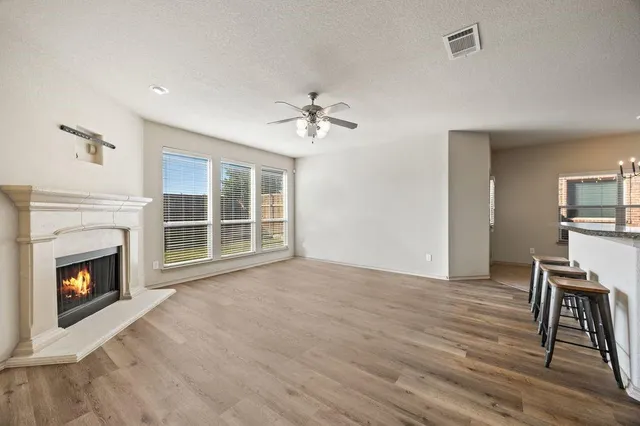 a kitchen with stainless steel appliances granite countertop stove top oven a sink dishwasher and a microwave oven with cabinets