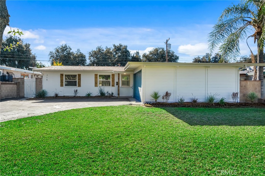 716 East Hanks Street Azusa, CA 91702 - Photo 1 of 14 a view of a backyard with plants and a garden