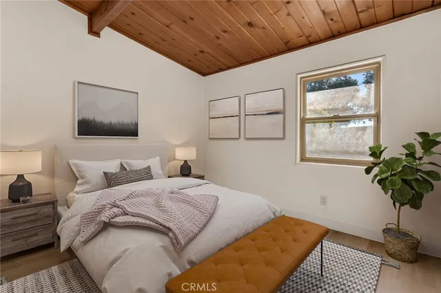 a bedroom with bed and a window