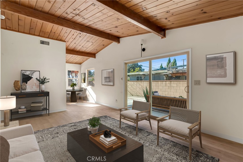 716 East Hanks Street Azusa, CA 91702 - Photo 2 of 14 a living room with furniture and a table