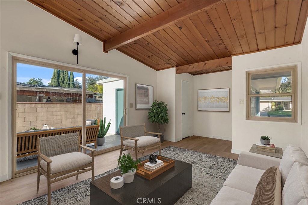 716 East Hanks Street Azusa, CA 91702 - Photo 3 of 14 a living room with furniture and a potted plant