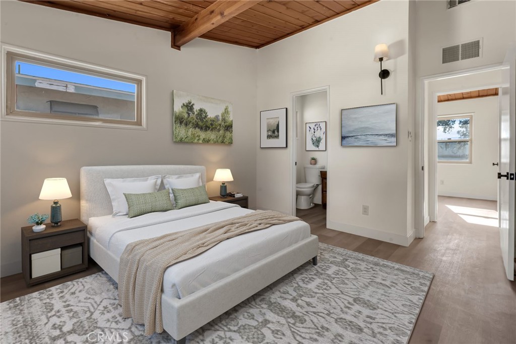 716 East Hanks Street Azusa, CA 91702 - Photo 10 of 14 a bedroom with a bed and wooden floor