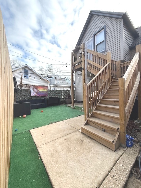 2115 West Barry Avenue, Unit CH Chicago, IL 60618 - Photo 14 of 15 a view of a house with a yard