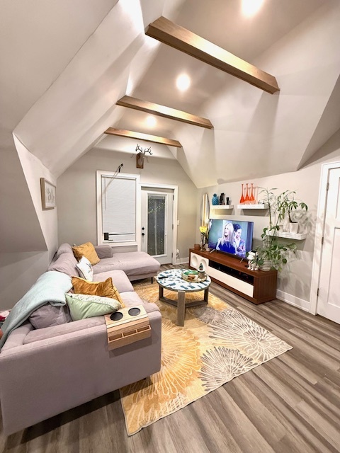 2115 West Barry Avenue, Unit CH Chicago, IL 60618 - Photo 4 of 15 a living room with furniture and a flat screen tv