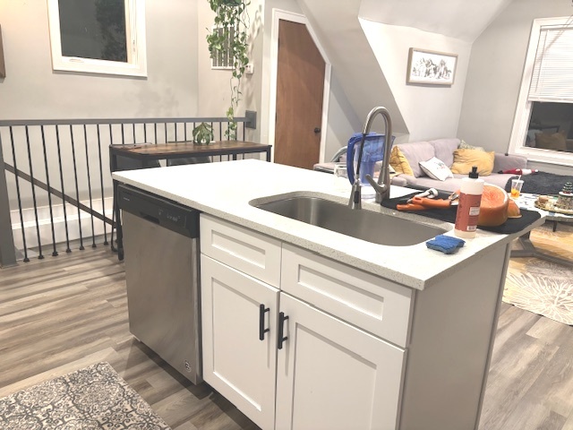 2115 West Barry Avenue, Unit CH Chicago, IL 60618 - Photo 6 of 15 a kitchen with a sink and a refrigerator