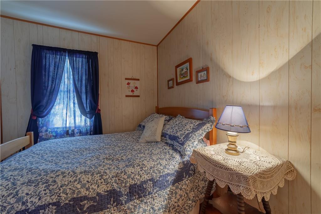 135 Lobster Cove Road Boothbay Harbor, ME 04538 - Photo 12 of 21 First floor bedroom with wood flooring