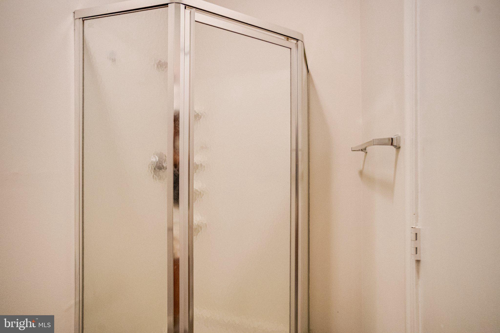 1813 Portship Road Dundalk, MD 21222 - Photo 29 of 50 Sleek glass shower for modern living.