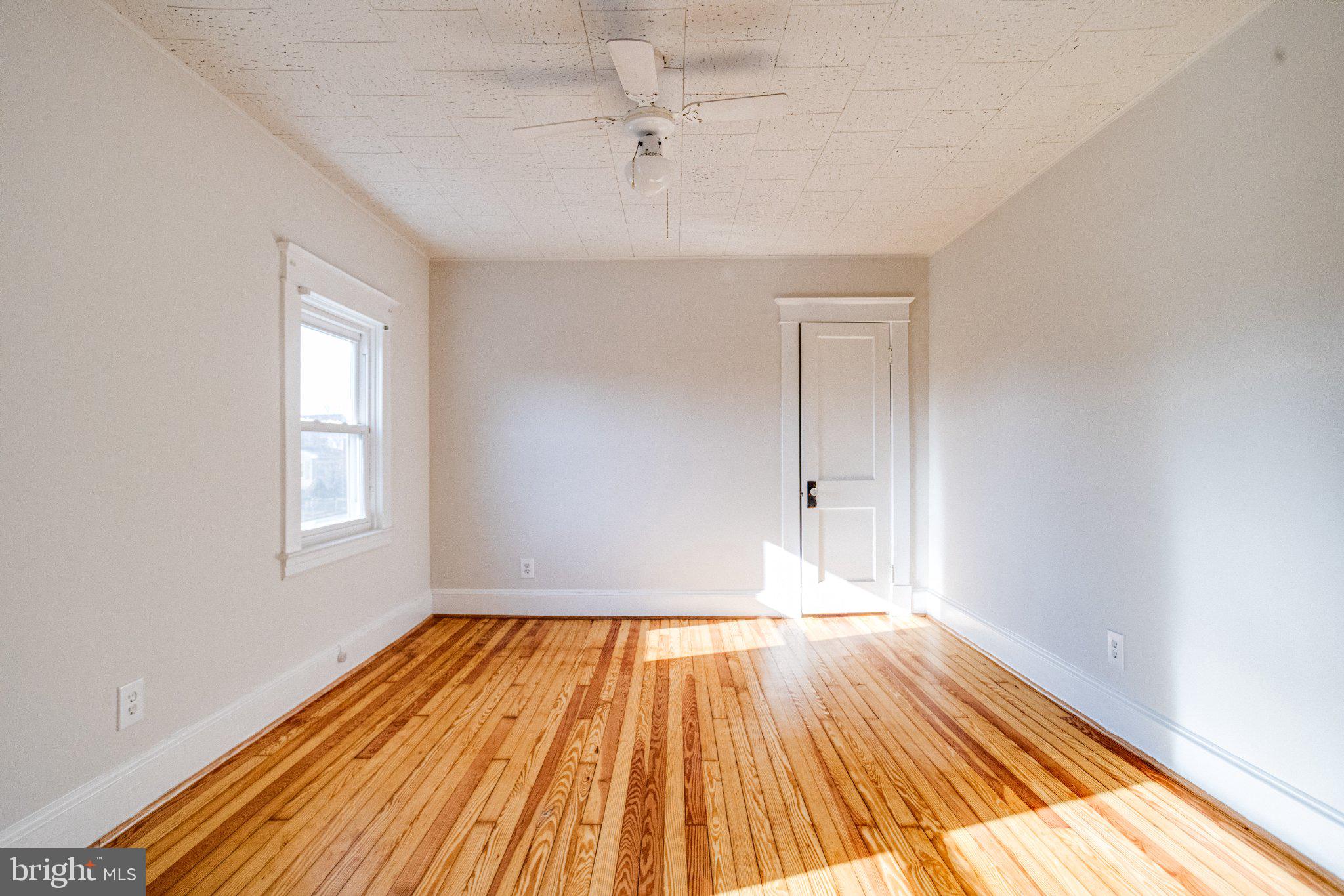 1813 Portship Road Dundalk, MD 21222 - Photo 31 of 50 Bright and airy room with hardwood floors.