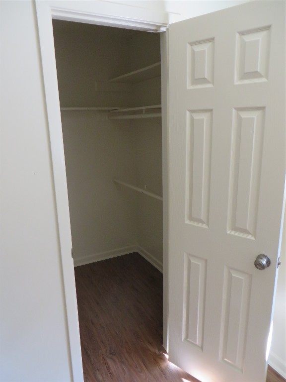 812 Ranch Road, Unit B Georgetown, TX 78628 - Photo 21 of 31 an empty room with wooden floor