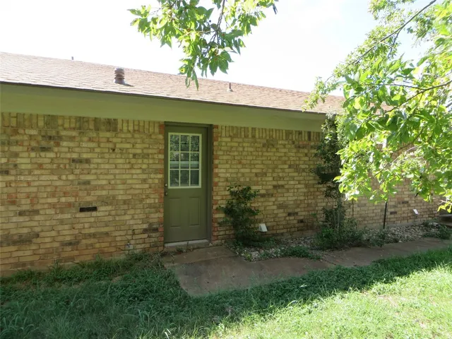 a view of a backyard with plants