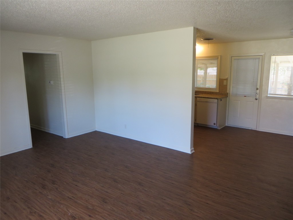 812 Ranch Road, Unit B Georgetown, TX 78628 - Photo 9 of 31 a view of a room with wooden floor and white walls