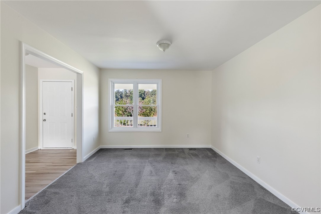 4540 Powhatan Lakes Road Powhatan, VA 23139 - Photo 11 of 23 an empty room with a window