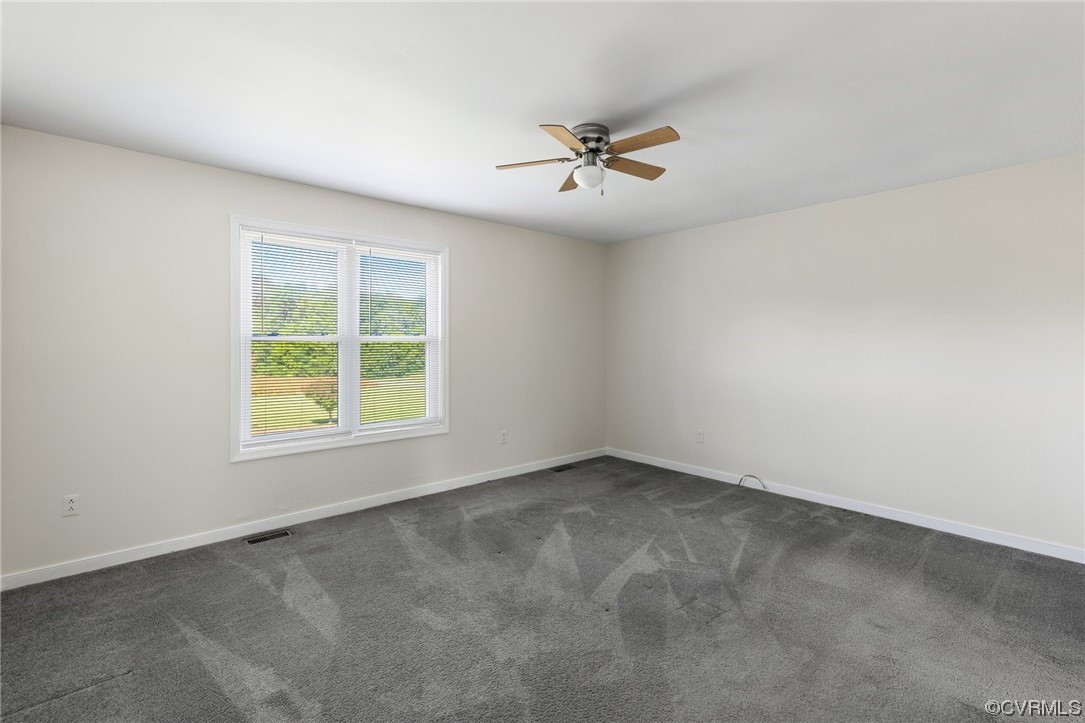 4540 Powhatan Lakes Road Powhatan, VA 23139 - Photo 13 of 23 wooden floor in an empty room with a window