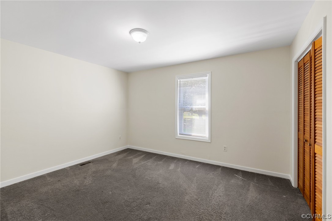 4540 Powhatan Lakes Road Powhatan, VA 23139 - Photo 19 of 23 an empty room with a window