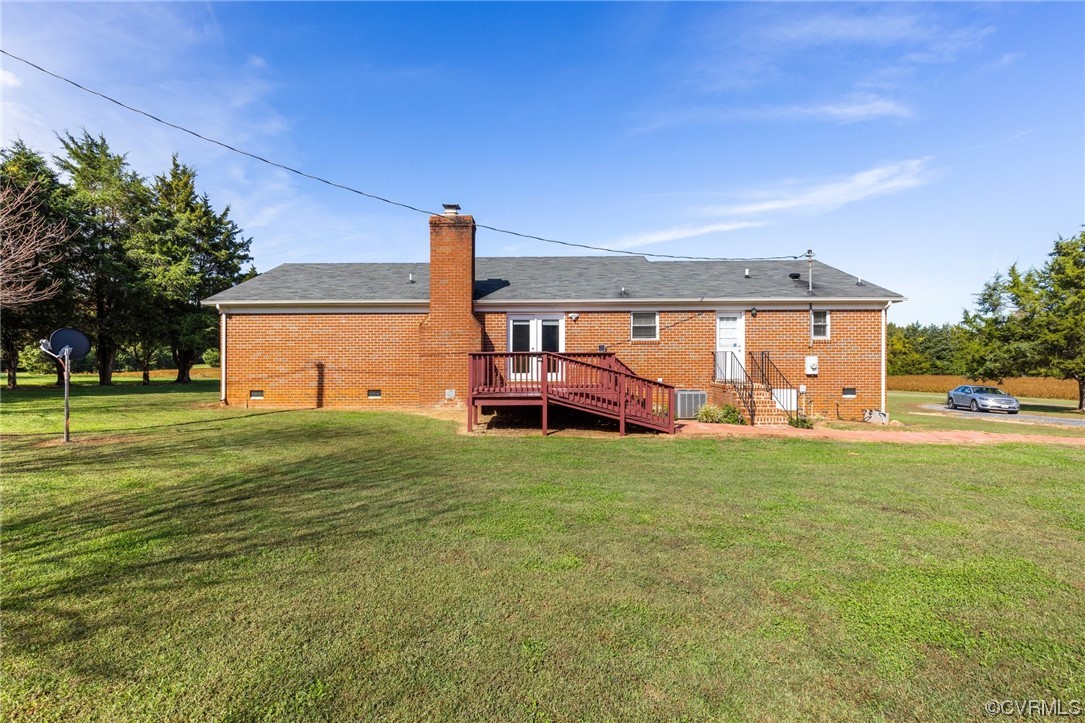 4540 Powhatan Lakes Road Powhatan, VA 23139 - Photo 23 of 23 a backyard of a house with table and chairs