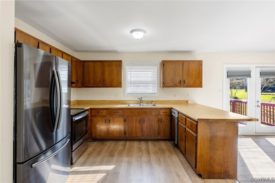4540 Powhatan Lakes Road Powhatan, VA 23139 - Photo 7 of 23 a kitchen with stainless steel appliances granite countertop a refrigerator sink and stove