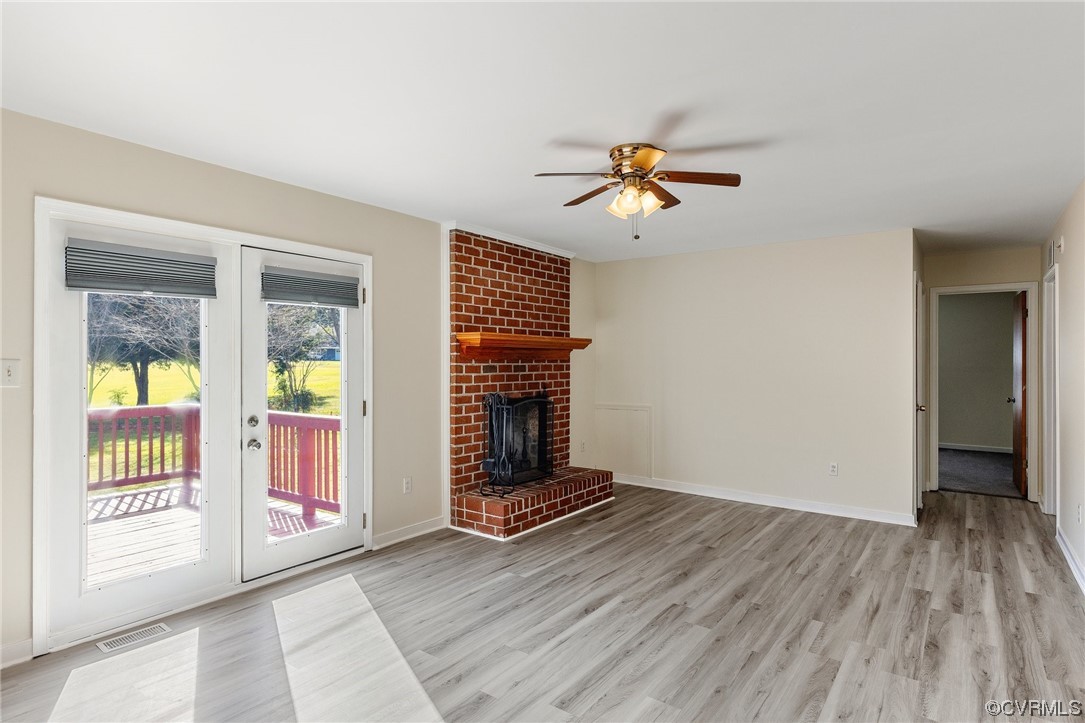 4540 Powhatan Lakes Road Powhatan, VA 23139 - Photo 8 of 23 wooden floor in an empty room with a window