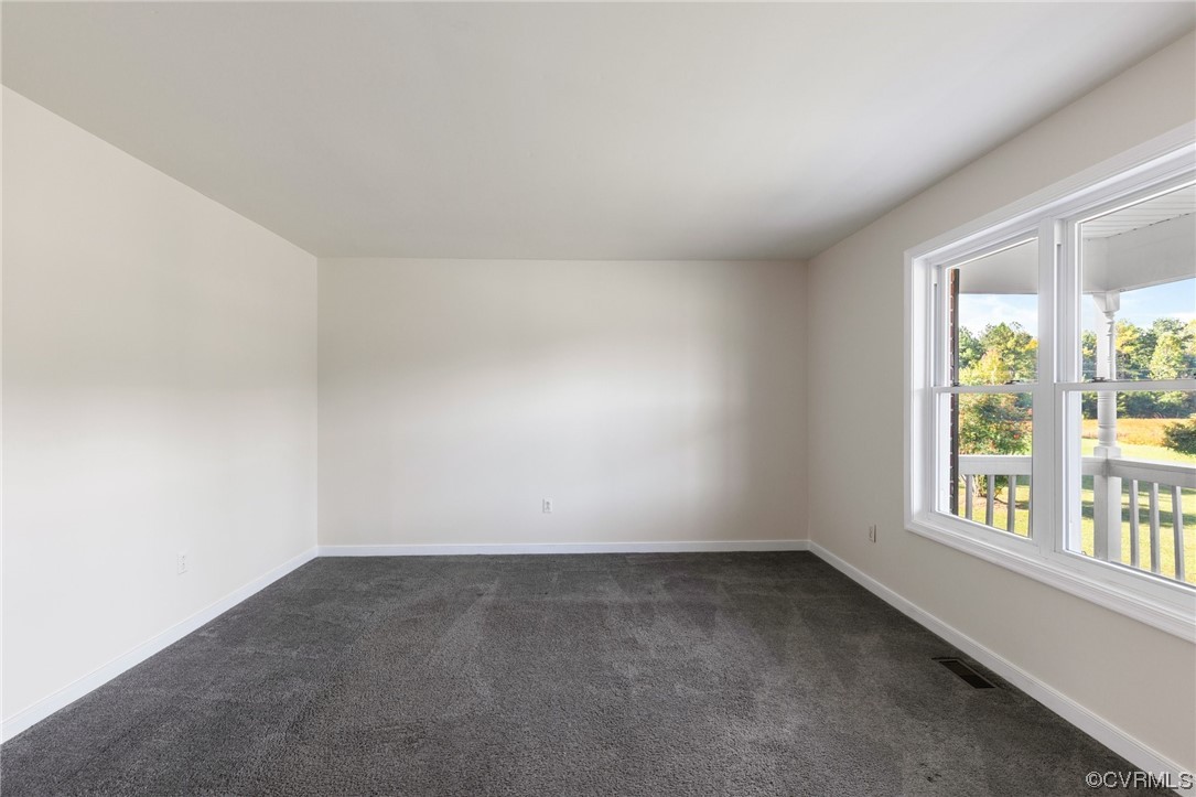 4540 Powhatan Lakes Road Powhatan, VA 23139 - Photo 9 of 23 an empty room with a window