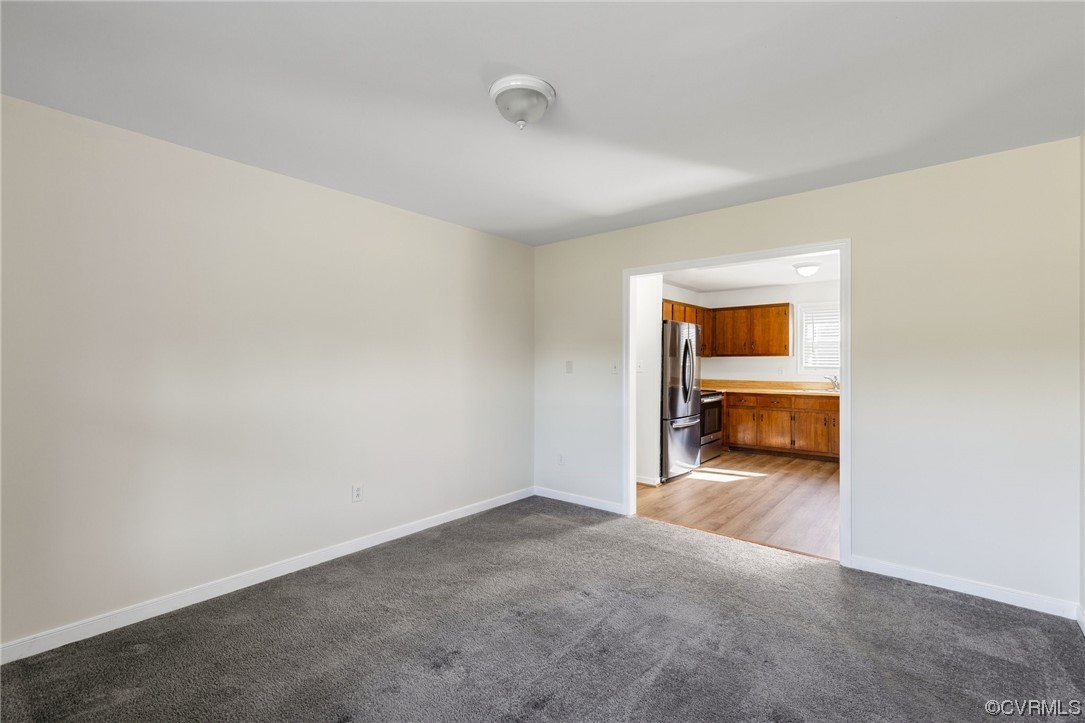 4540 Powhatan Lakes Road Powhatan, VA 23139 - Photo 10 of 23 a view of a room with wooden floor and windows