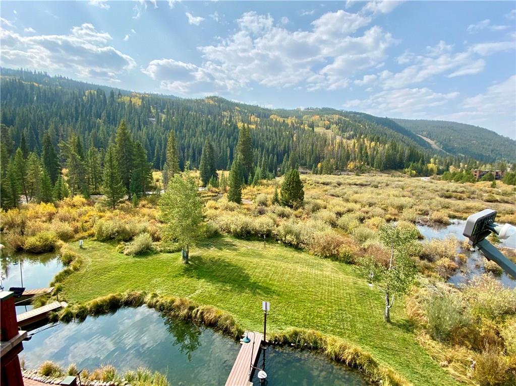 56 River Run Road, Unit 301 Keystone, CO 80435 - Photo 1 of 30 a view of a lake with a yard