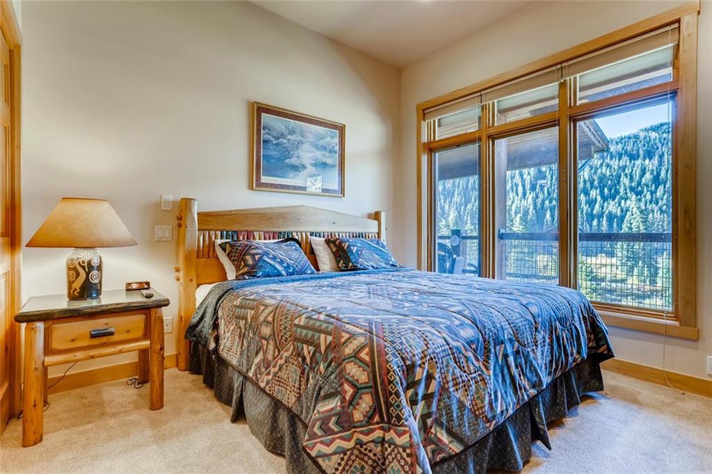 56 River Run Road, Unit 301 Keystone, CO 80435 - Photo 13 of 30 a bedroom with a bed and a window