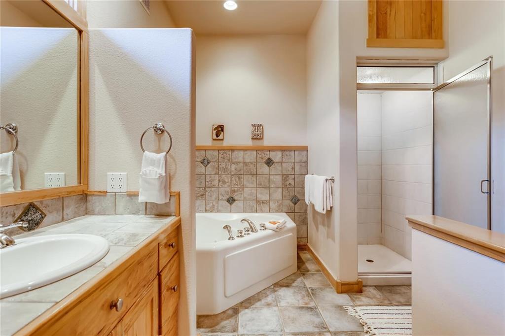 56 River Run Road, Unit 301 Keystone, CO 80435 - Photo 15 of 30 a bathroom with a bathtub and a sink