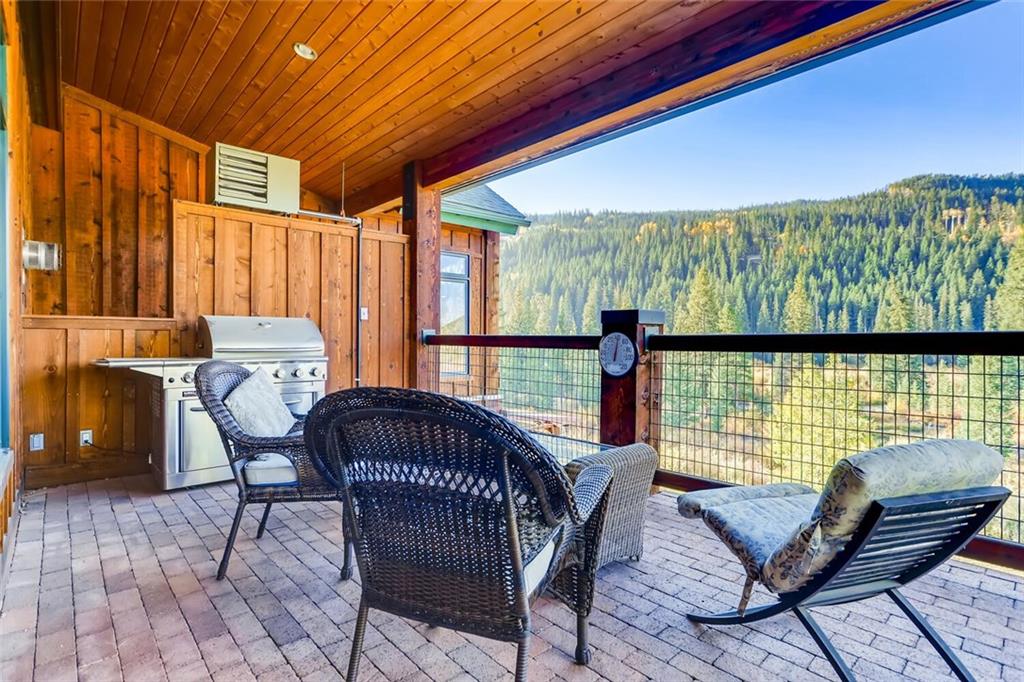 56 River Run Road, Unit 301 Keystone, CO 80435 - Photo 25 of 30 a view of a chair and table in the balcony