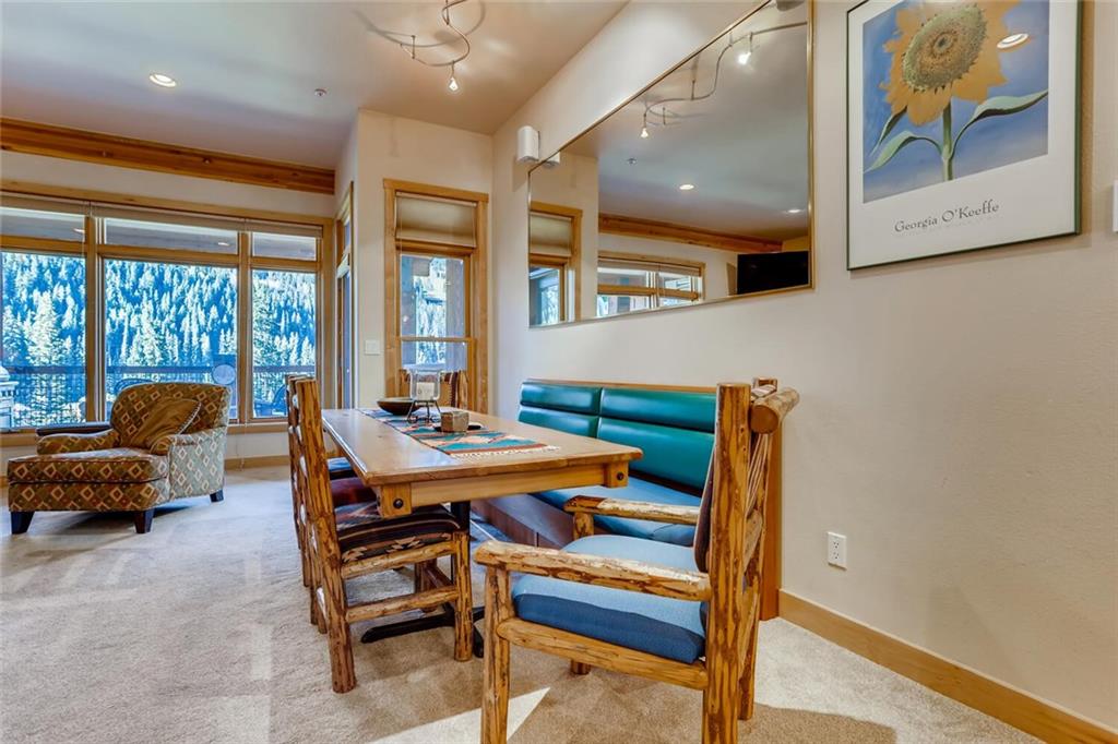 56 River Run Road, Unit 301 Keystone, CO 80435 - Photo 9 of 30 a room with furniture and a large window