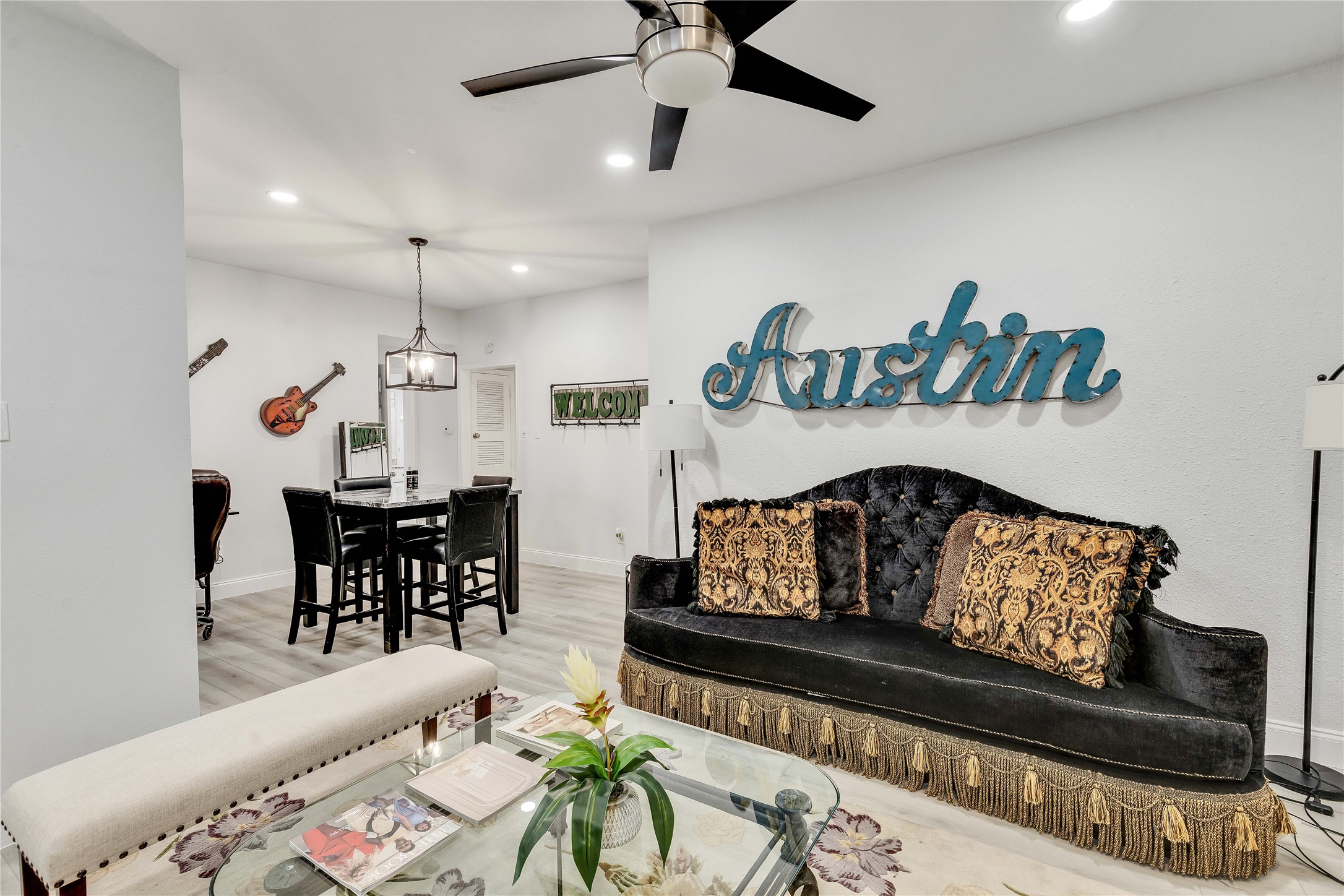 2529 Rio Grande Street, Unit 56 Austin, TX 78705 - Photo 10 of 16 Living room with light wood-style floors, baseboards, ceiling fan, and recessed lighting