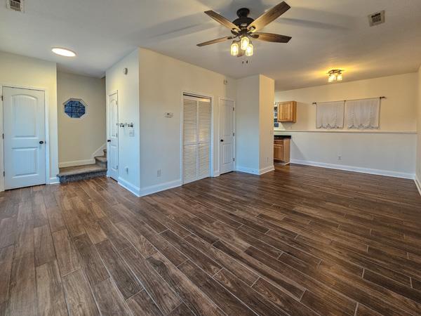 175 Boardtown Road Ellijay, GA 30540 - Photo 11 of 29 a view of an empty room and kitchen with wooden floor
